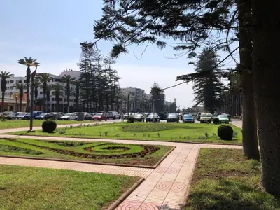 a park with cars parked on a city street at Apartment with large terrace Mohammedia in Mohammedia