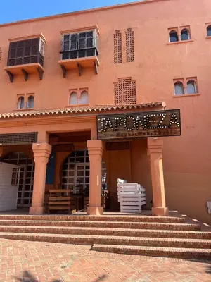 a building with stairs in front of a building at Luxury Beach Front Cherrat Plage Apartment in Sidi el Haj Bou Derbala