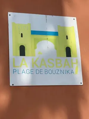 a sign that reads la kazabal place de bolivia at Luxury Beach Front Cherrat Plage Apartment in Sidi el Haj Bou Derbala