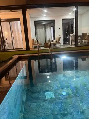 a swimming pool with a slide in a house at Apartement avec piscine privée Casablanca in Casablanca