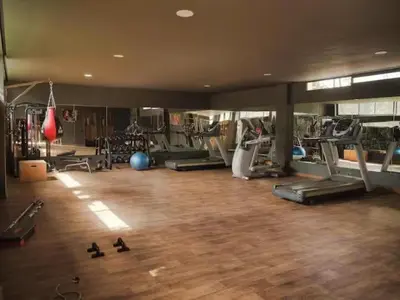 a gym with several treadmills and exercise machines at Apartement avec piscine privée Casablanca in Casablanca