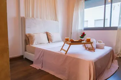 a bedroom with a bed with a tray of fruit on it at VIVASTAY Casablanca - Urban Nest 3 Bedrooms High Standing Les Princesses in Casablanca