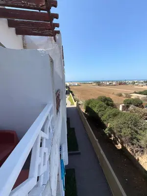 a balcony of a house with a view of the ocean at Cozy Dream Land Appartement 1 bed room Sea View, Sidi Rahal Beach in Sidi Rahal