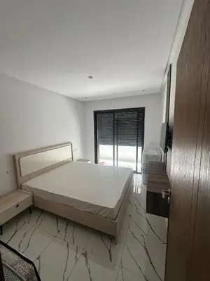 a bedroom with a bed and a large window at Calm studio in Casablanca