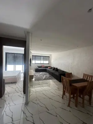 a living room with a couch and a table at Calm studio in Casablanca