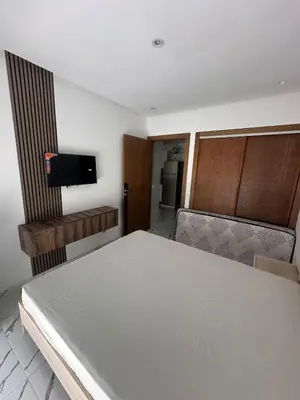 a room with a bed and a tv in a room at Calm studio in Casablanca