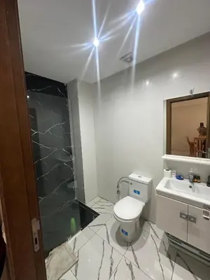 a bathroom with a shower and a toilet and a sink at Calm studio in Casablanca