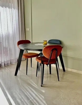 a table with four chairs and a bowl on top at Logement cosy avec terrasse in Casablanca