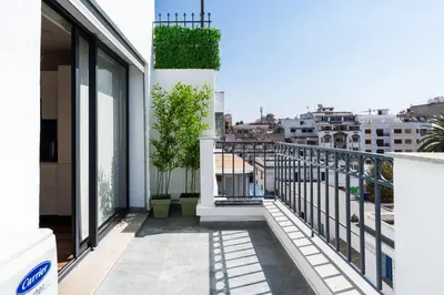 a balcony with a view of the city at Résidence Dunkerque - Duplex in Casablanca