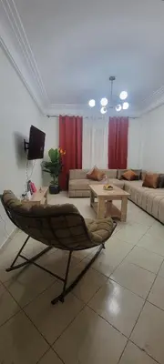 a living room with a couch and a table at Appartement casablanca in Casablanca
