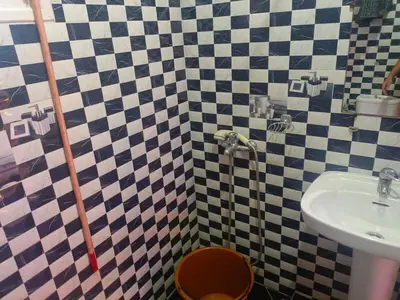 a bathroom with a sink and a toilet at appartement à al tilal in Mohammedia