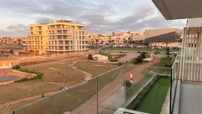 a view of a city from a balcony of a building at Blue Carrousel in Rabat