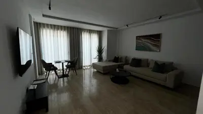 a living room with a couch and a table at Prestige Aman in Casablanca