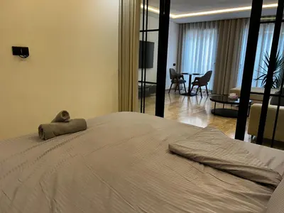 a bedroom with a bed with a stuffed animal on it at Prestige Aman in Casablanca