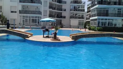 a large swimming pool in front of some buildings at appartement a la residence marina beach a mohammedia plage in Mohammedia
