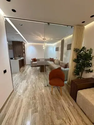 a living room with a couch and a chair at New Living House in Casablanca