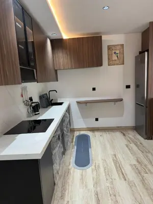 a kitchen with a blue dog door in the floor at New Living House in Casablanca