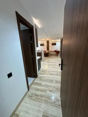 a hallway leading to a kitchen and a living room at New Living House in Casablanca