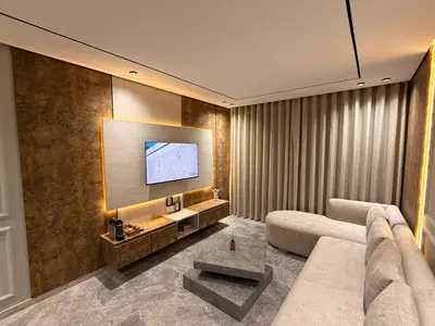 a living room with a couch and a flat screen tv at Sweet Stay in Casablanca