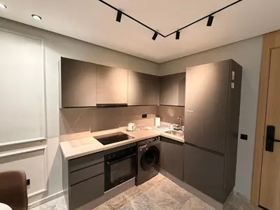 a kitchen with a refrigerator and a dishwasher at Sweet Stay in Casablanca