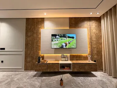 a living room with a television on a wall at Sweet Stay in Casablanca