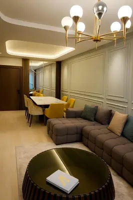 a living room with a couch and a table at Margueri Luxe in Mohammedia