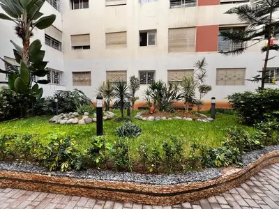 a garden in front of a building at Maison Vacances in Casablanca