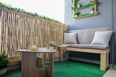 a bench and a table in a room at R107- Incredible 1BR Apartment with King size bed and Green Balcony in Casablanca