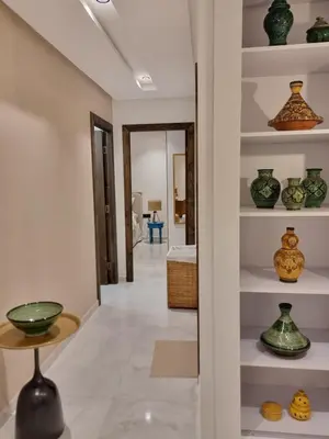 a hallway with vases on shelves in a house at downtown rabat luxury in Rabat