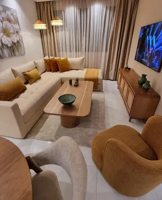 a living room with a couch and a table at downtown rabat luxury in Rabat