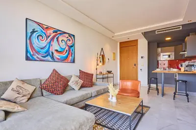 a living room with a couch and a table at Le loft du soleil B living in Casablanca