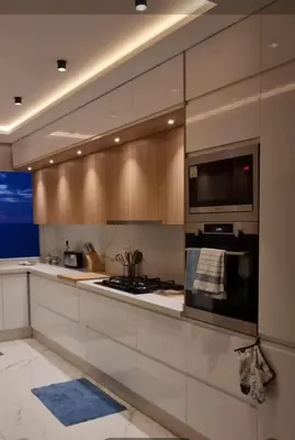 a kitchen with a stove and a microwave at Blue paradise in Rabat