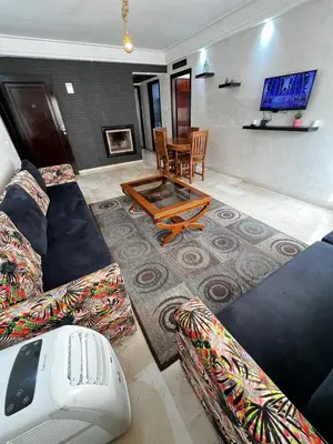 a living room with two couches and a table at Complexe Horizon in Casablanca