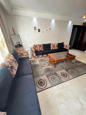 a living room with a couch and a coffee table at Complexe Horizon in Casablanca