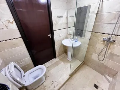a bathroom with a toilet and a sink and a shower at Complexe Horizon in Casablanca