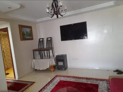 a living room with a flat screen tv on the wall at Casablanca in Casablanca