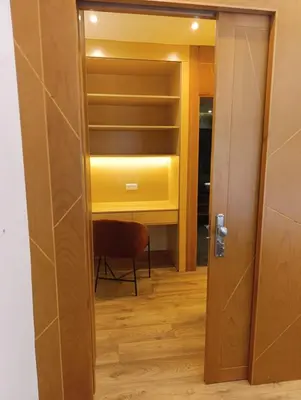 a door leading into a room with a closet at Hamza in Temara