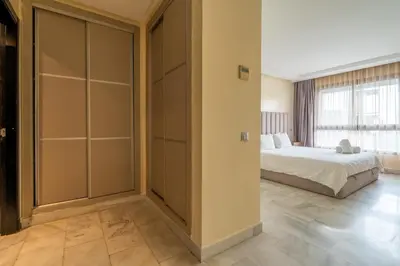 a bedroom with a bed and a large closet at Yacht appartement Waterfront Complex 2 Bedrooms 2 Bathrooms in Casablanca