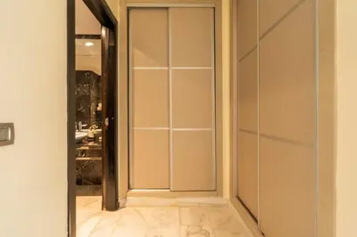 a walk in closet with a glass door at Yacht appartement Waterfront Complex 2 Bedrooms 2 Bathrooms in Casablanca