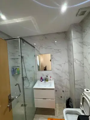 a bathroom with a shower and a sink at Cosy Studio meublé in Casablanca