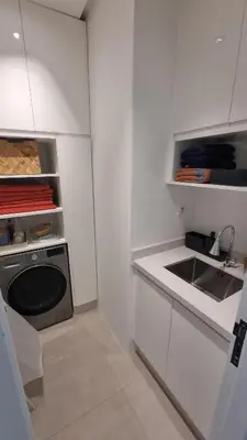 a white kitchen with a sink and a stove at majorelle luxury in Rabat