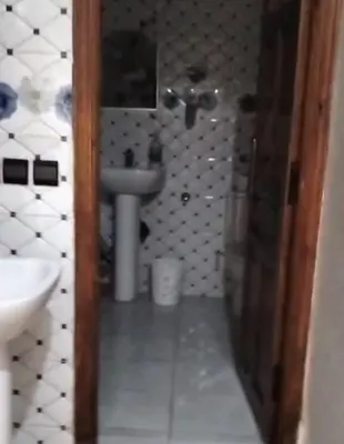 a bathroom with a sink and a toilet in it at Appartement Jad in Deroua