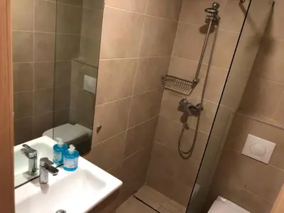 a bathroom with a shower and a sink at CAN25 2ch au centre de mohammedia in Mohammedia