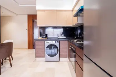 a kitchen with a washer and a dishwasher at C06 Apartment - Luxury, Style & Wellness in Casablanca