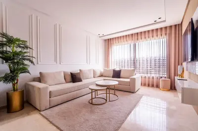 a living room with a couch and a table at C06 Apartment - Luxury, Style & Wellness in Casablanca