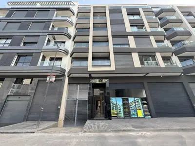 a large apartment building with the front door open at C06 Apartment - Luxury, Style & Wellness in Casablanca