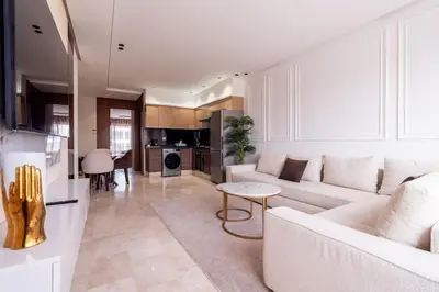a living room with a white couch and a table at C06 Apartment - Luxury, Style & Wellness in Casablanca