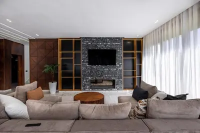 a living room with a couch and a fireplace at Villa Indigo in Rabat