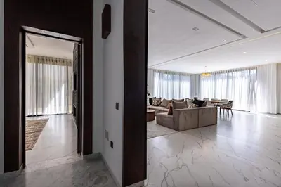 a living room with a couch and a table at Villa Indigo in Rabat