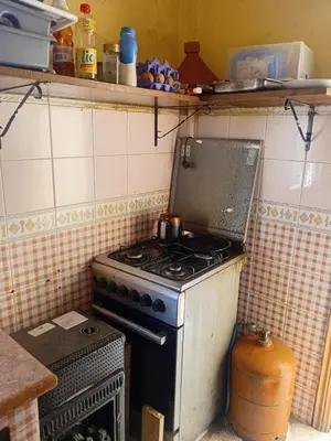 a kitchen with an old stove in a kitchen at Belle chambre pour 2 sidi maarouf in Casablanca